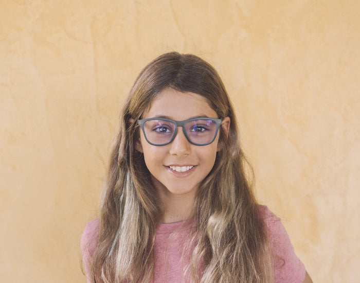STORY girl wearing sunski mini headland bluelight glasses
