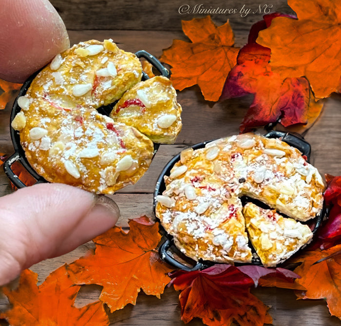hand holding miniature pies