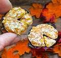 hand holding miniature pies