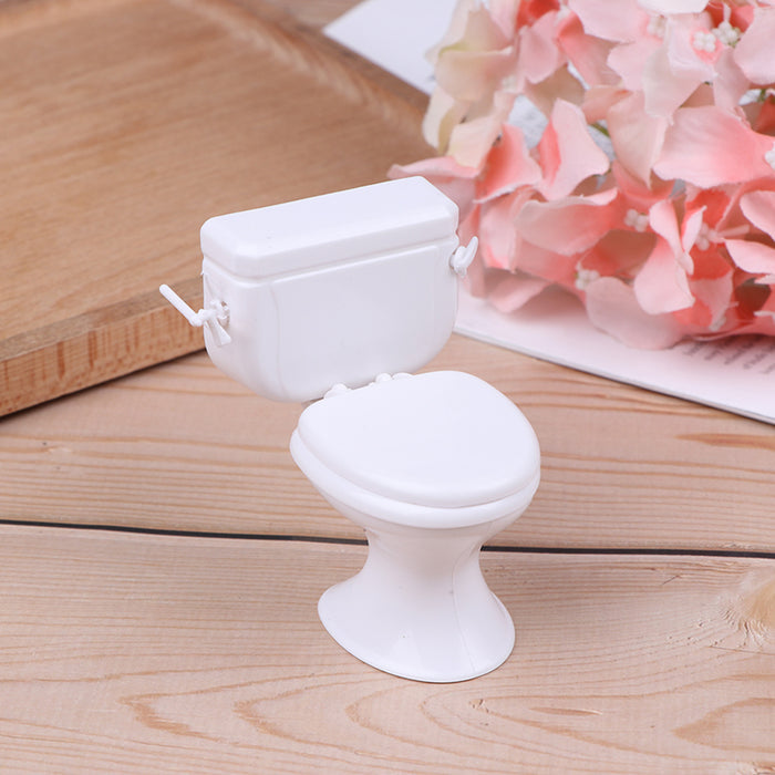White dollhouse toilet