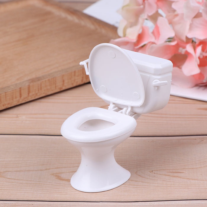 White dollhouse toilet side view