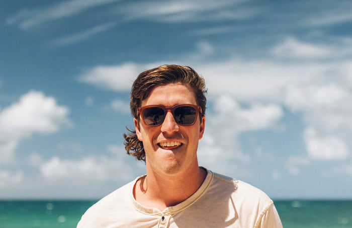 PROD_SUN_MO_RSL man smiling wearing sunski moraga sunglasses