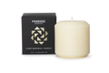 A natural 3 inch  ivory pillar candle next to its black packaging box with a geometric pattern, labeled as 'Penrose Pure Beeswax Candle'.