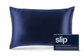 A navy blue slip silk queen pillowcase with branded packaging on a white background.