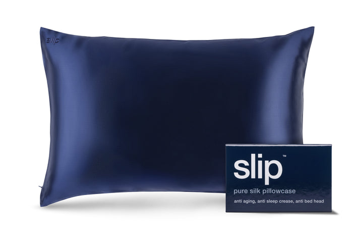 A navy blue slip silk queen pillowcase with branded packaging on a white background.