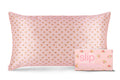 A king-sized silk pillowcase with a pink floral pattern with matching slip packaging on a white background.