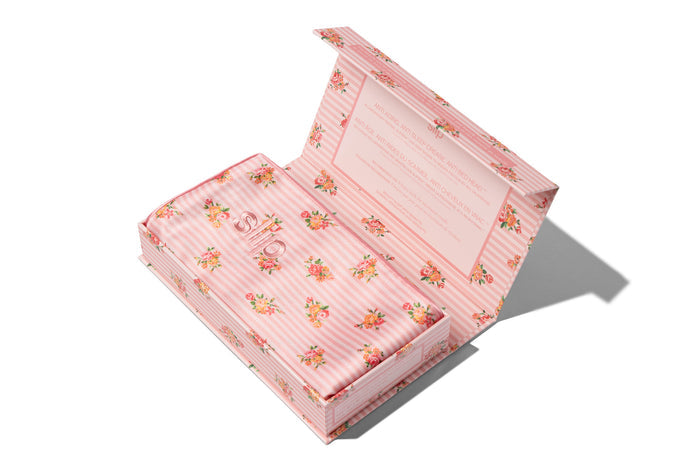 Floral pattern slip king pillowcase inside it's packaging on a white background.
