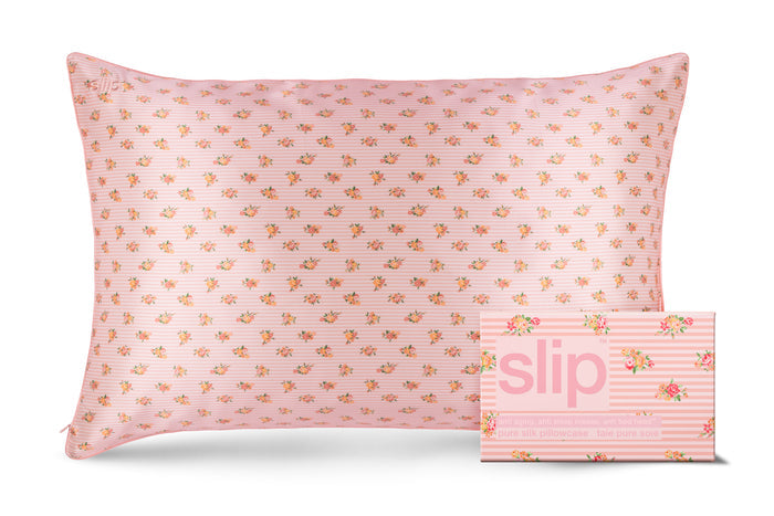 A floral pink and white stripe pattern slip silk queen pillowcase with branded packaging on a white background.