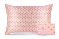 A floral pink and white stripe pattern slip silk queen pillowcase with branded packaging on a white background.