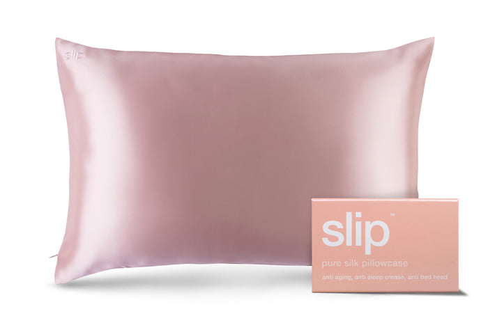A pink slip silk queen pillowcase with branded packaging on a white background.