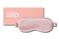 A pink slip silk sleep mask with branded box on a white background.