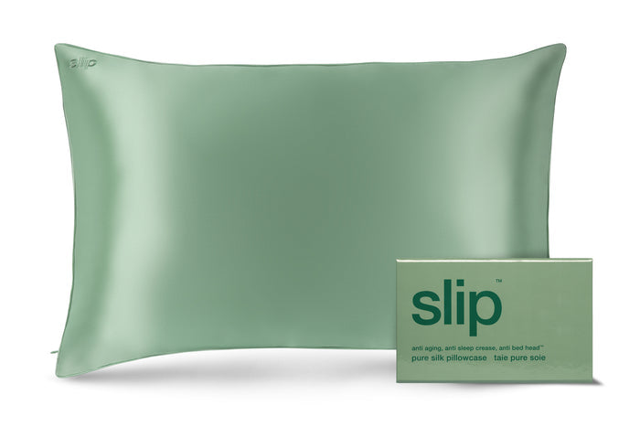 A pistachio green pillowcase with an invisible zipper closure. The pillowcase is displayed alongside it's packaging with the brand name 'slip' visible.