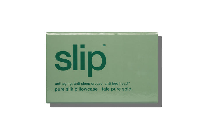Pistachio green slip silk pillowcase packaging on a white background.