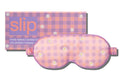 A slip silk contour sleep mask with a pink and purple checkered pattern and embroidered daisies, designed for eyelash extension wearers. Displayed alongside slip packaging on a white background.