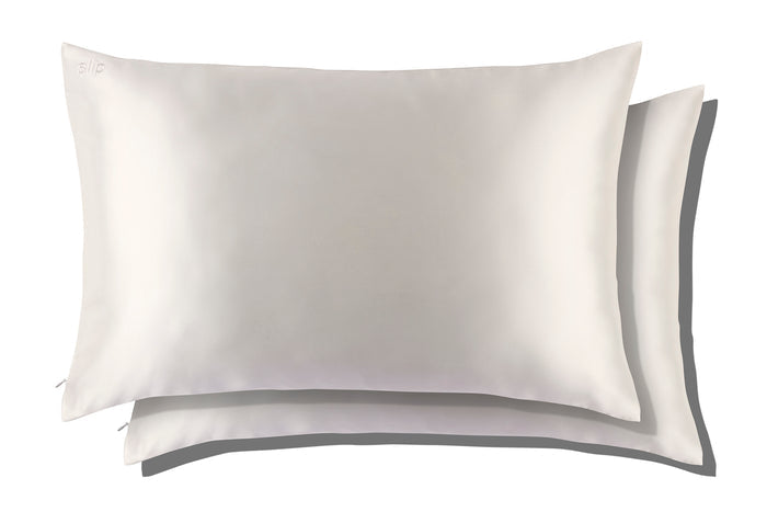 Two white slip silk queen pillowcases on a white background.