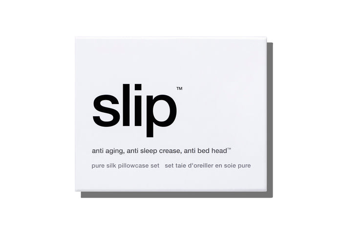 White slip silk queen pillowcases branded packaging on a white background.