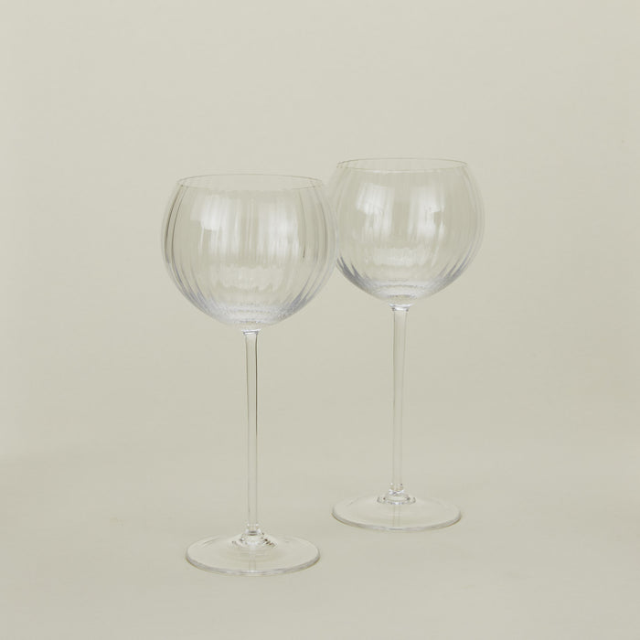 Set of two ribbed clear wine glasses.