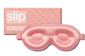 A rose slip silk contour sleep mask designed to protect delicate eyelash extensions, with the brand name 'slip' visible on the packaging.