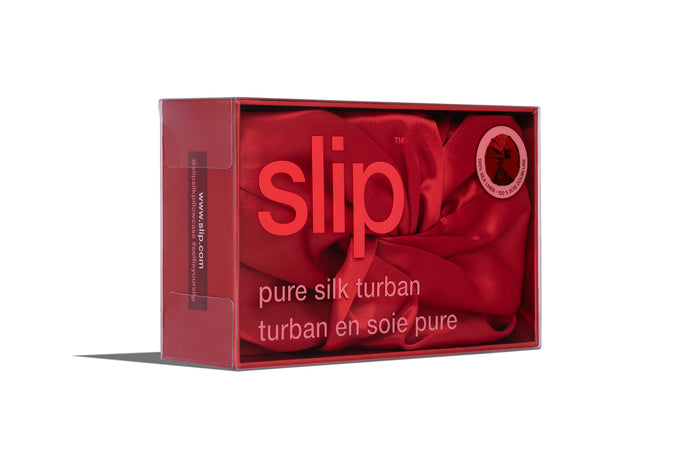Box of red slip pure silk turban on a white background