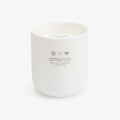 A white ceramic candle jar with a label that reads 'Summer Rain on the Forest Trail', part of the Scents of Oregon collection.