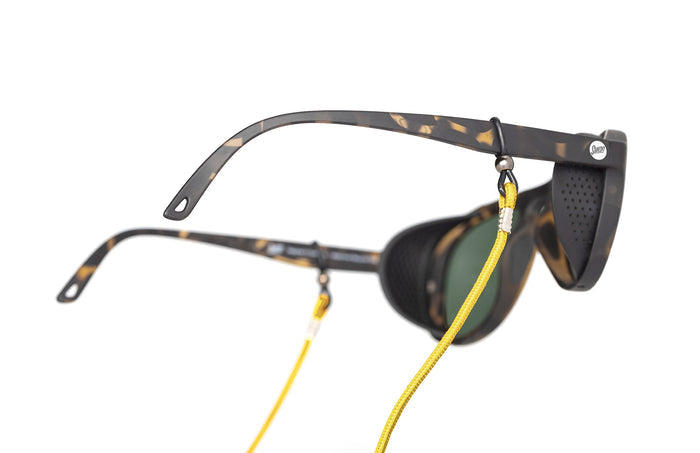 PROD_ACC_SRD_YE sunski sunglasses retainer yellow on a pair of alpine sunglasses