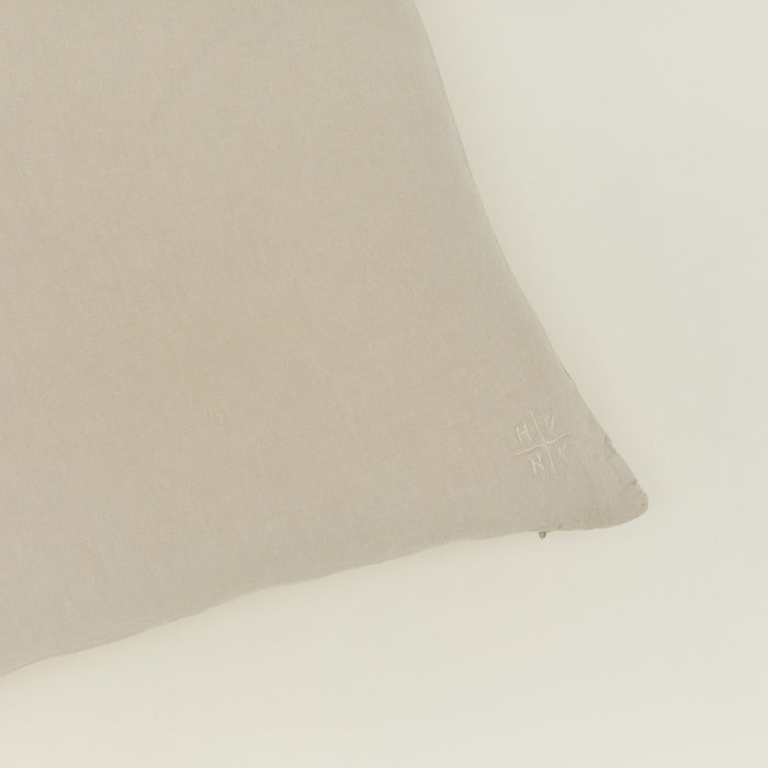 Close up view of simple linen pillow in flax