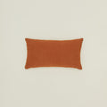 Simple linen pillow in terracotta