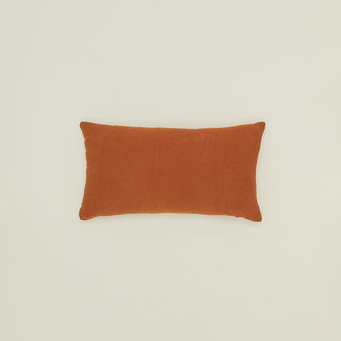 Simple linen pillow in terracotta