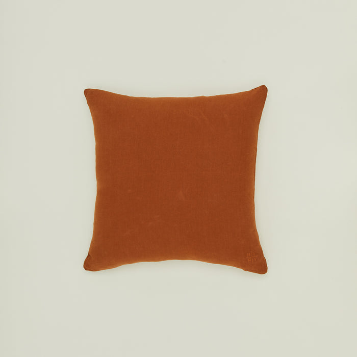 Simple linen pillow in terracotta