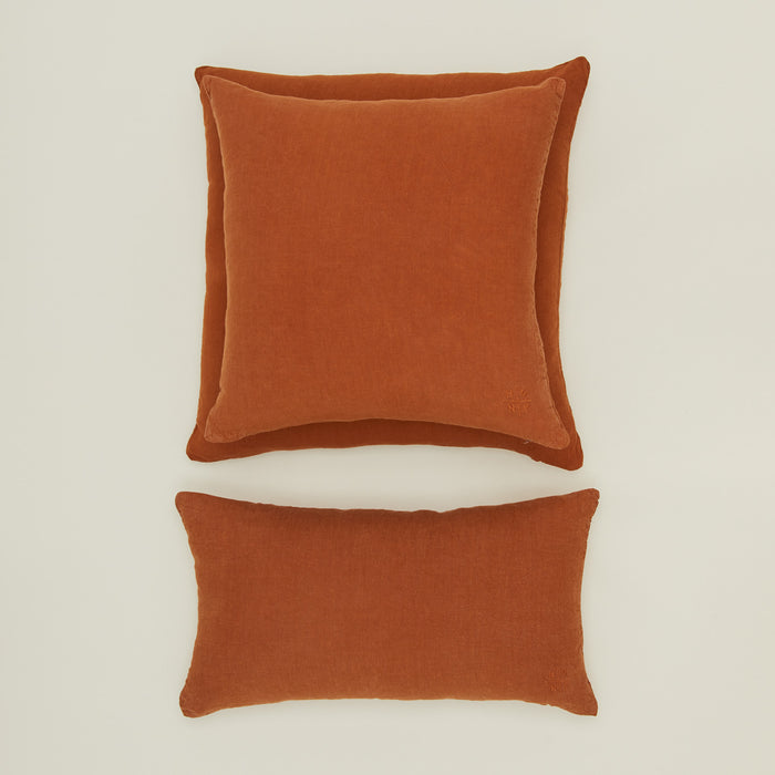 Simple linen pillow in terracotta