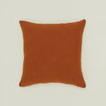 Simple linen pillow in terracotta