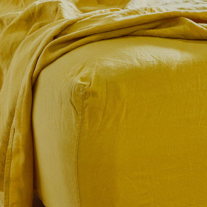 Simple linen bedding in mustard