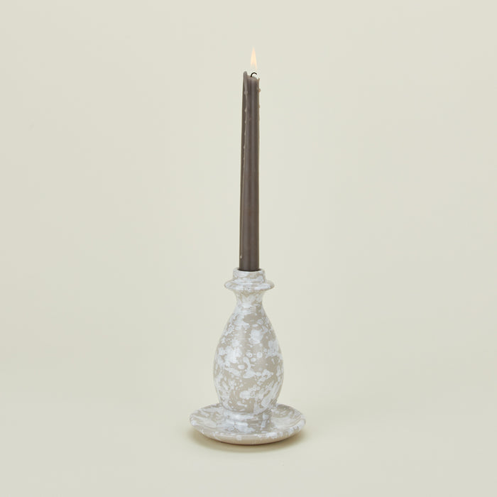 Large splatterware candlestick holder in white and grey with candle