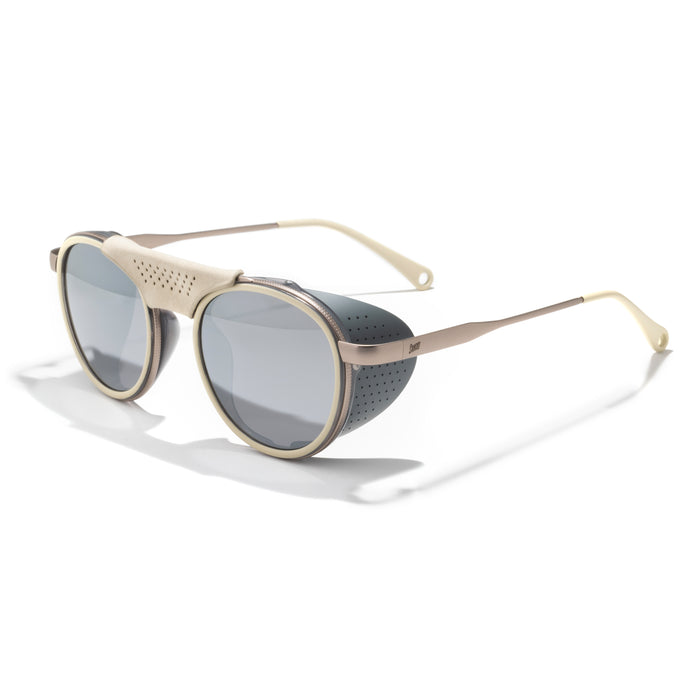 Sunglasses with gold frame and dark lenses on a white background