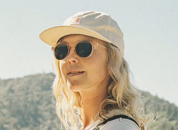 RICH girl wearing sunski sunglasses and sunski sun up hat