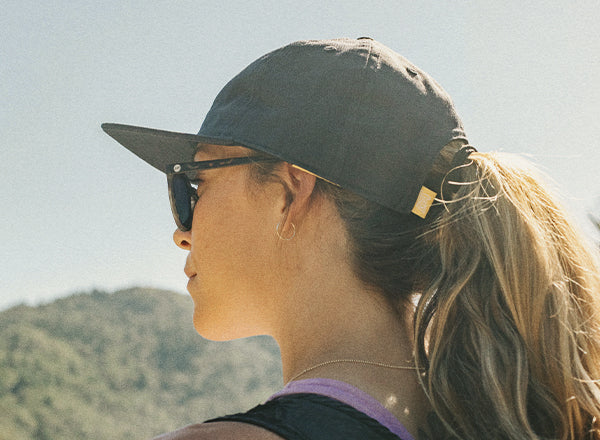 RICH back angle of sunski sunburst hat on a woman