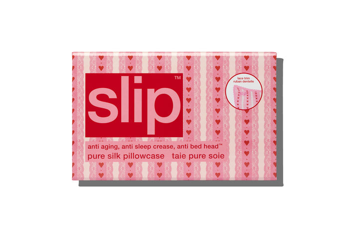 Packaging of slip pure silk pillowcase with heart pattern on a white background