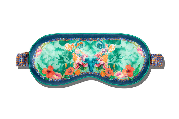 Taurus pure silk sleep mask with floral patterns, predominantly in blue, green and orange, on a white background.
