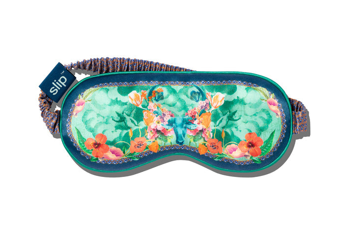 Taurus pure silk sleep mask with floral patterns, predominantly in blue, green and orange with a slip tag.
