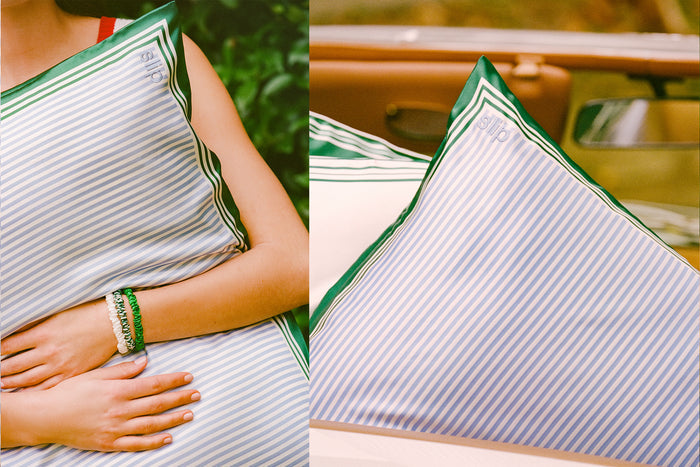 Striped pillowcase with green and white border, close-up view showing slip embroidery