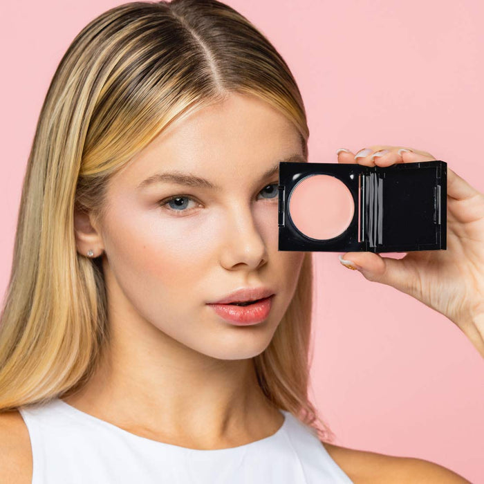 Soft Pink shade of Palladio Under Eye Brightener shown on fair to light skin tone model.