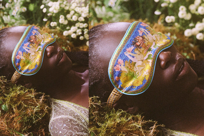 Model wearing Virgo pure silk sleep mask in a forest setting.