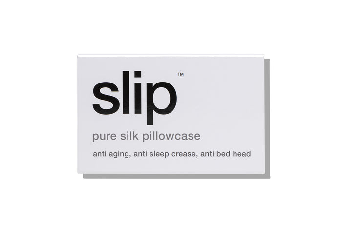 White slip silk queen pillowcase branded packaging on a white background.