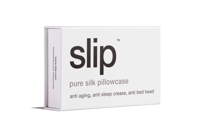 White slip silk queen pillowcase branded packaging on a white background.