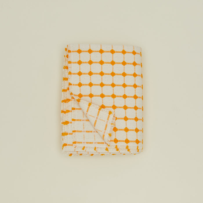 Dove and Donkey wicker fringed tablecloth in marigold