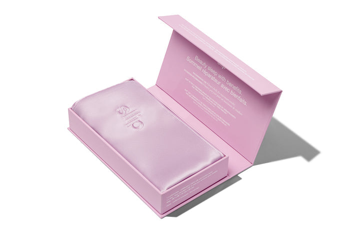 A lilac slip silk king pillowcase displayer in open box packaging on a white background.